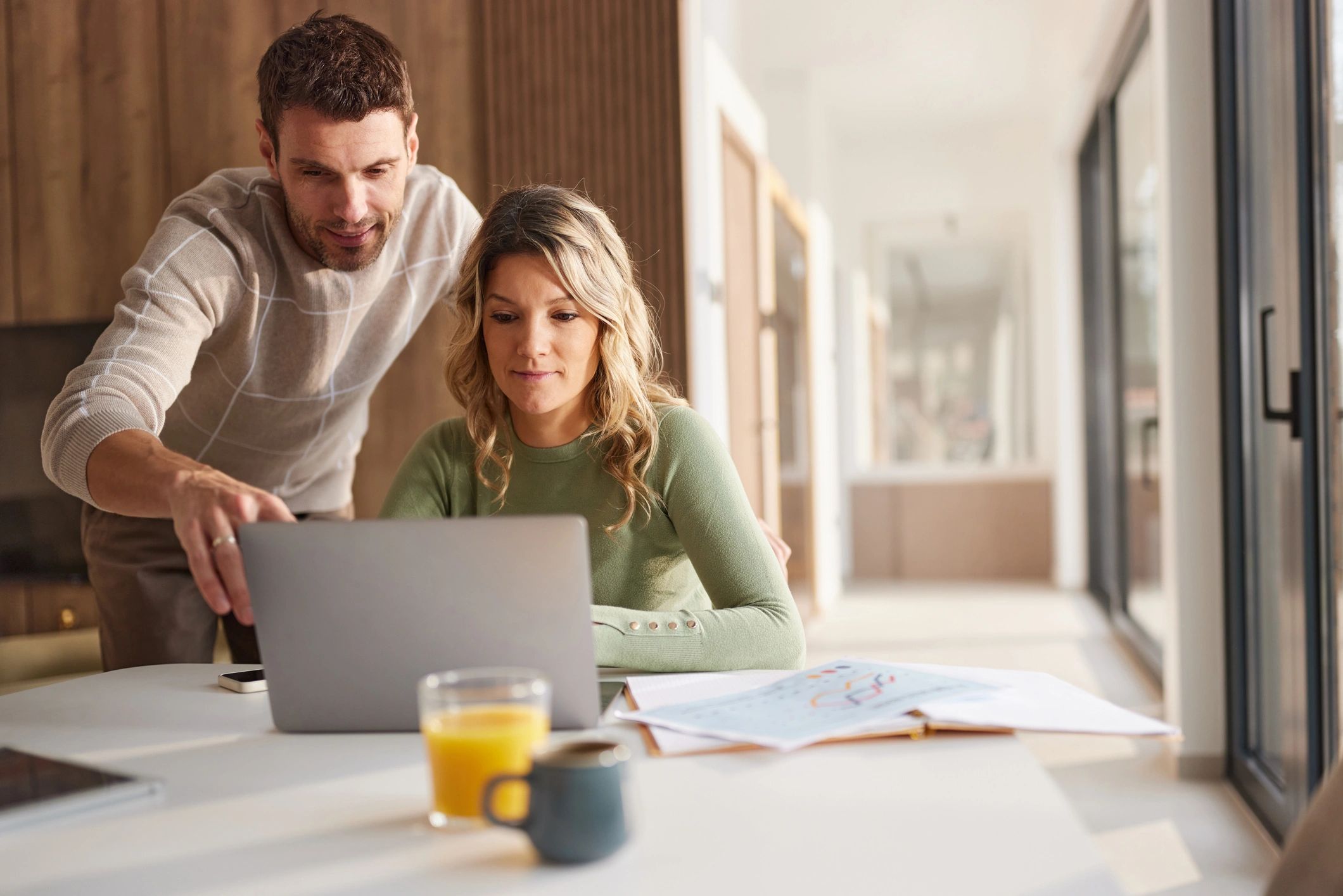 Clients reviewing information on a laptop